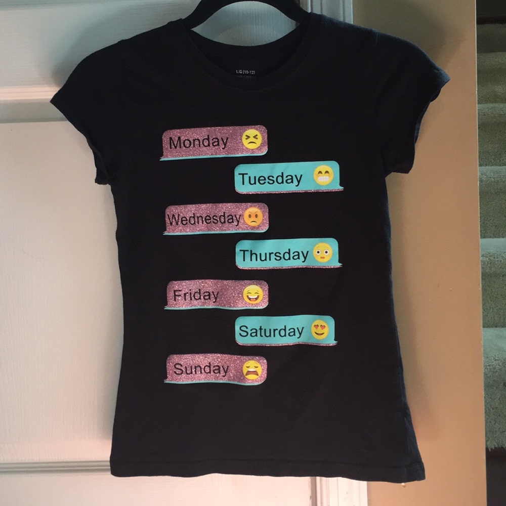 A black short sleeve date of the week shirt.